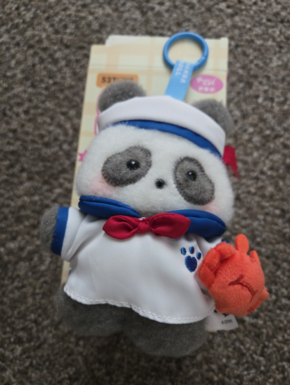 52TOYS Happy Weekend Panda Roll plush bag charm.